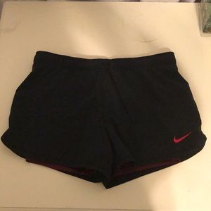 Black Nike shorts with maroon spandex
